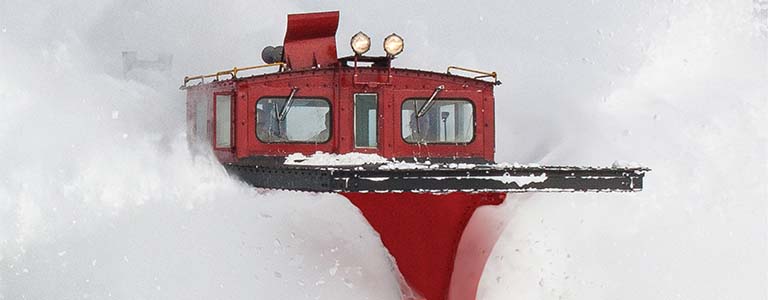 Abstract red train on the tracks during a snow storm
