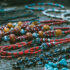 Bead necklaces arranged on stone table