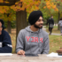 Students sitting on a picnic bench.