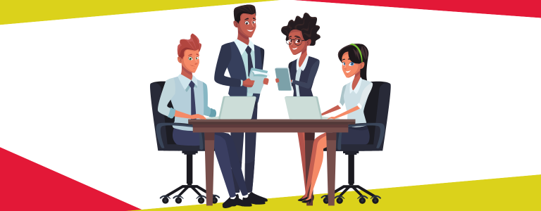 Four people sitting around a desk in a corporate environment