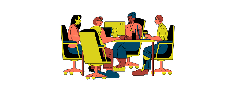 our people discussing around a table with a computer in an office setting.