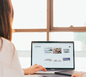 Two people looking at a laptop screen