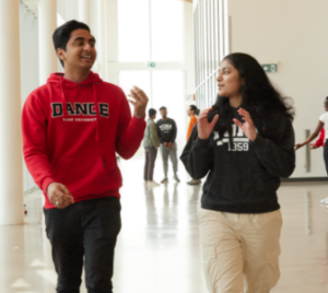 two york university students walking in a hallway